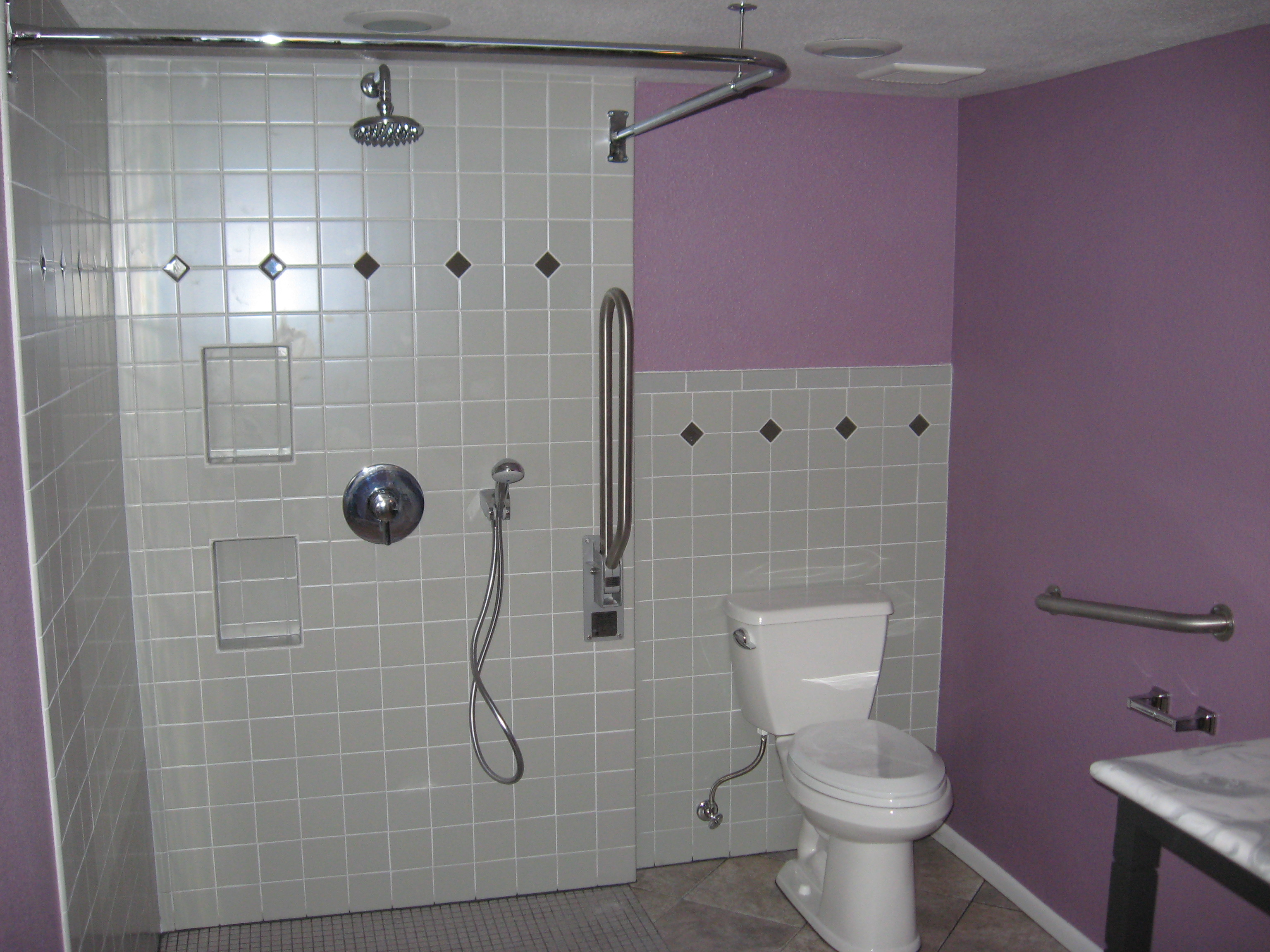 tiled bathroom shower and toilet image